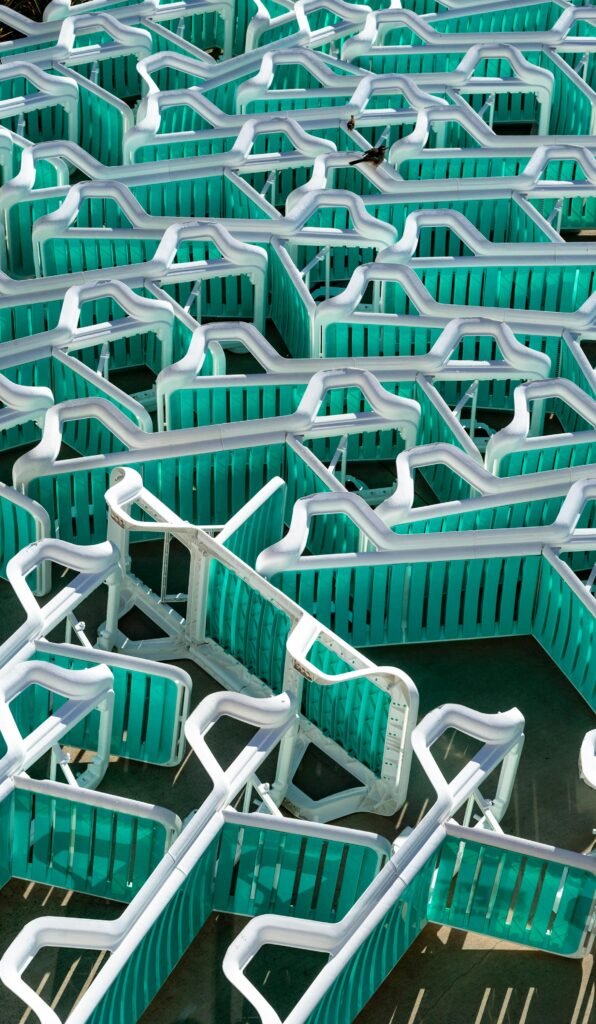 Aerial shot of a vibrant turquoise outdoor maze in Mar del Plata, Argentina.